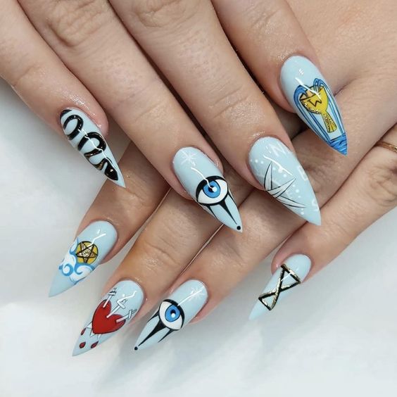 manicura en tonos azul cielo; Manicuras para abrir tu tercer ojo de bruja y alejar las malas vibras