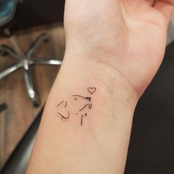 Silueta de perrito ;15 Hermosos tatuajes para mostrar que eres una 'animal lover'