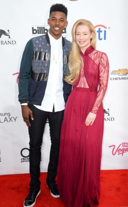 Iggy Azalea y Nick Young posando por separado para una fotografía