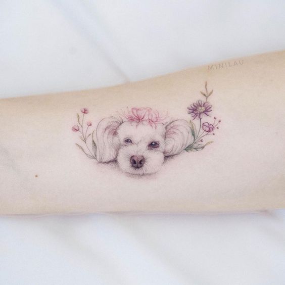 Perrita con efecto acuarela ;15 Hermosos tatuajes para mostrar que eres una 'animal lover'