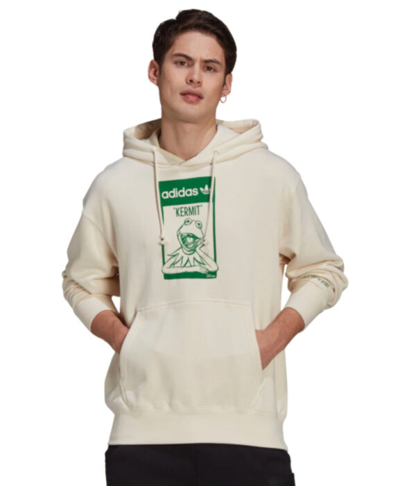 Línea de ropa y calzado de Adidas, Stan Smith Disney; sudadera color hueso con estampado verde de la Rana René