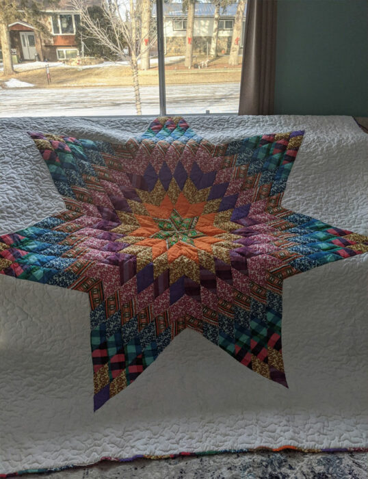 Colcha con una estrella decorando el centro