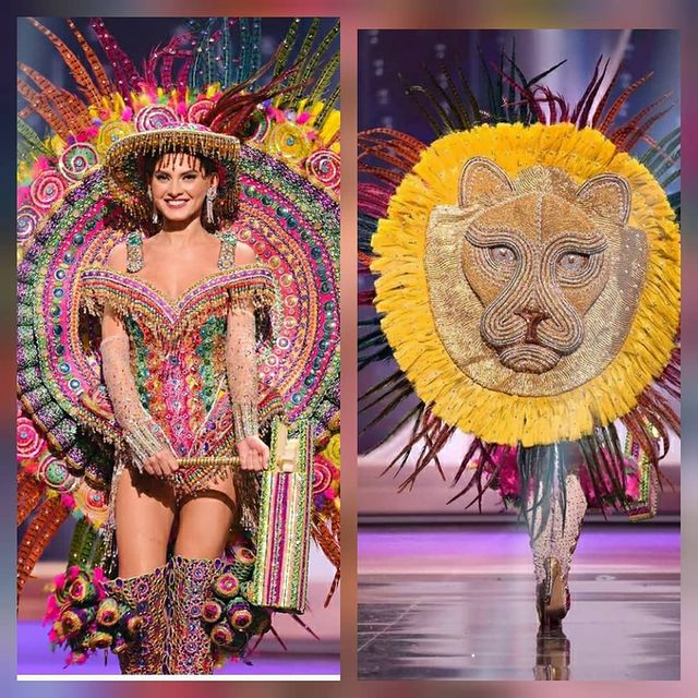 Miss universo usando su traje típico en forma de león con diferentes colores