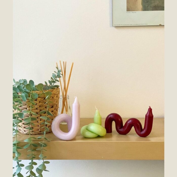 Velas flexibles en colores rosas, verdes y guindas