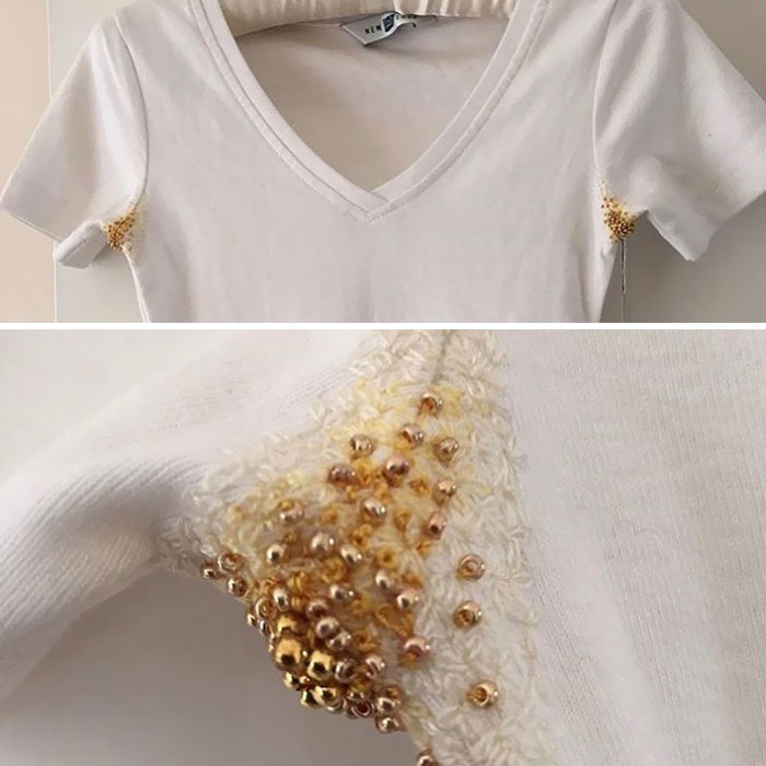 Camisa blanca con perlas amarillas en las axilas
