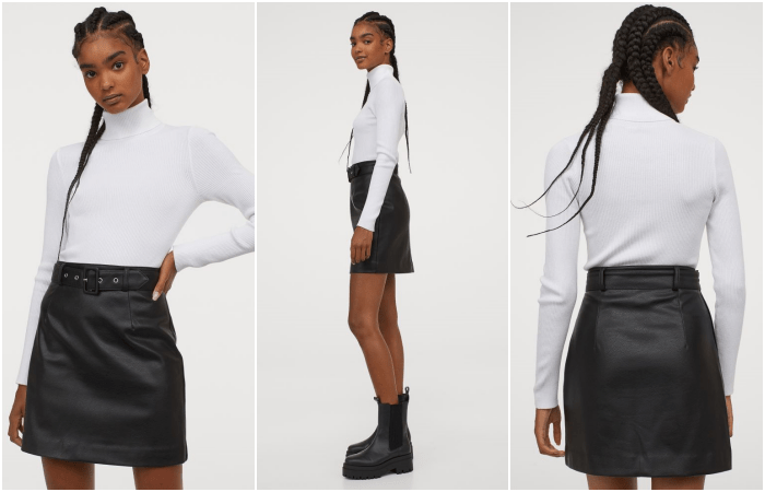 chica morena usando un top de manga larga blanco, y cuello alto, falda de cuero negro con cinturón y botines negros de suela negra