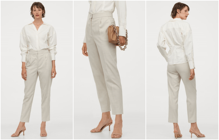 chica de cabello corto usando una camisa de botones y manga larga blanca, pantalón de vestir beige recto, bolso beige de mano y sandalias beige de tacón