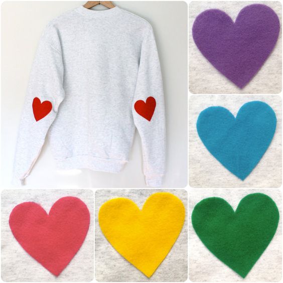 Suéter blanco decorado con parches de corazones