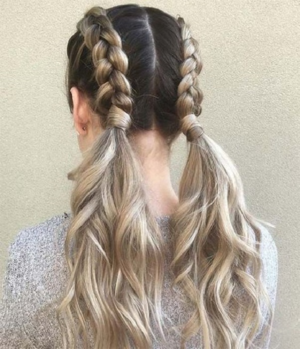 Chica peinada con dos trenzas holandesas