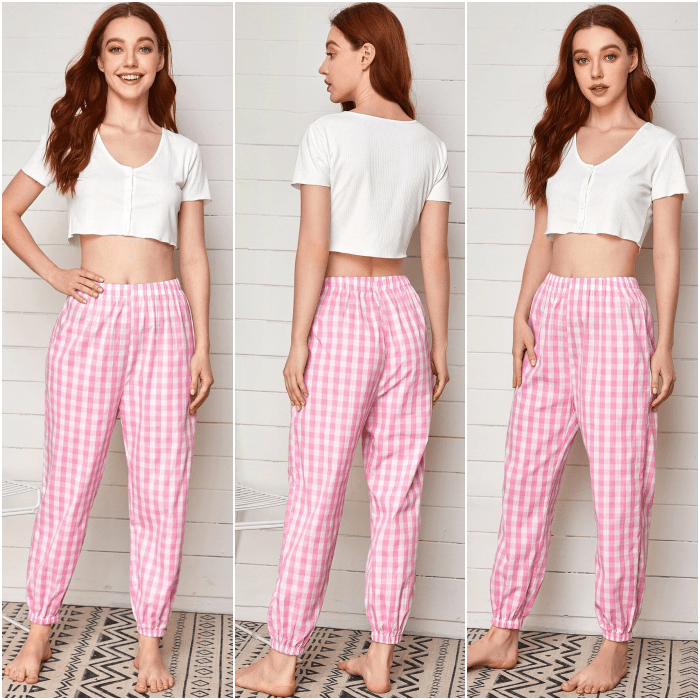 chica de cabello largo usando una pijama con crop top blanco de manga corta y pantalón rosa con líneas blancas