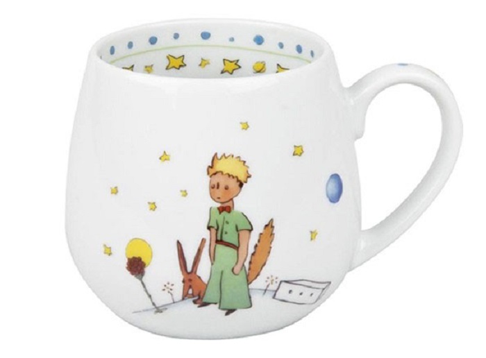 Taza inspirada en El Principito, donde aparece el Principito y el zorro junto con algunas estrellas