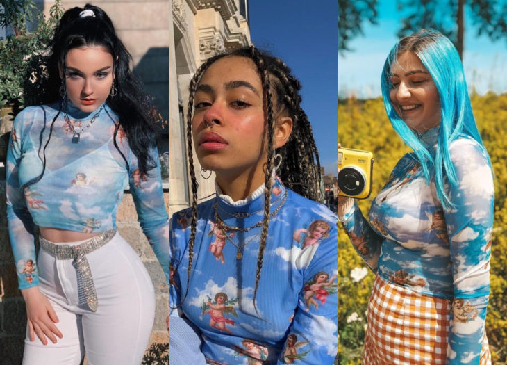 Ropa trendy; blusas azules con estampado de ángeles; chica de cabello negro en una coleta alta, mujer morena con trenzas africanas, mujer de cabello azulado pastel