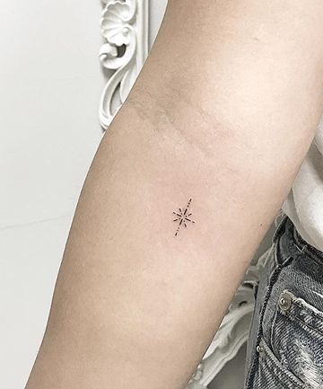 Tatuaje de estrella en el brazo