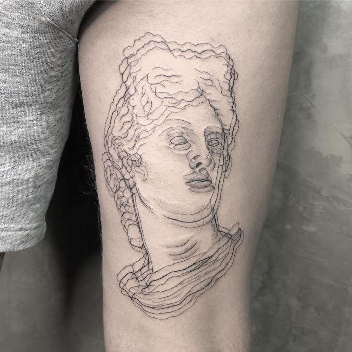 Tatuaje de ilusión óptico de la cabeza de un griego