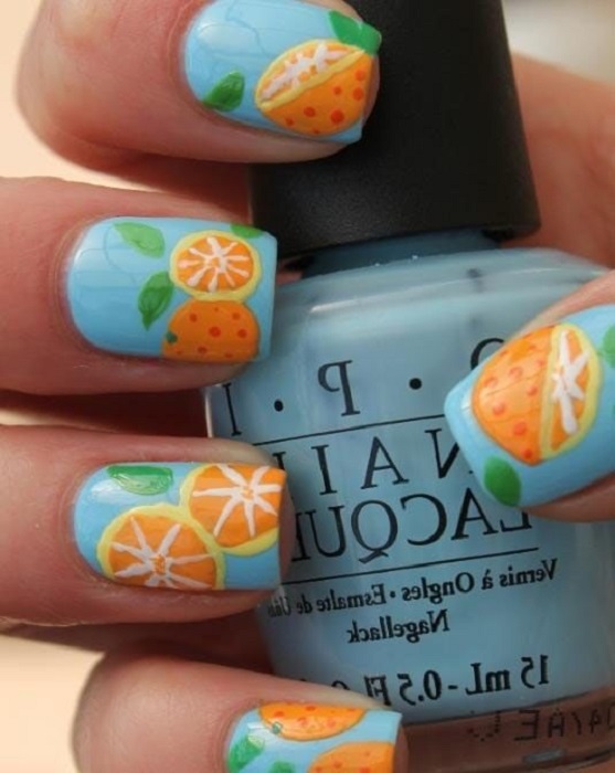 Diseño de manicure de naranjas