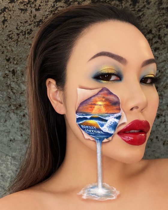 Maquillaje de ilusión óptica de rostro rompiéndose y desbordándose el mar