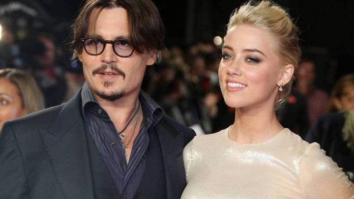 Amber Heard y Johnny Depp en una alfombra roja