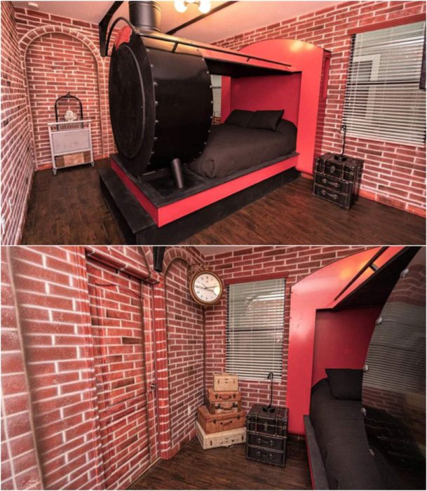 Habitación decorada con papel tapiz de ladrillo y una cama en tonos negros en forma de expreso 