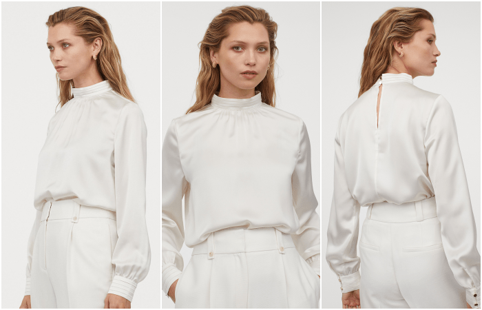 chica rubia usando una blusa de satén blanca con pantalones beige claros
